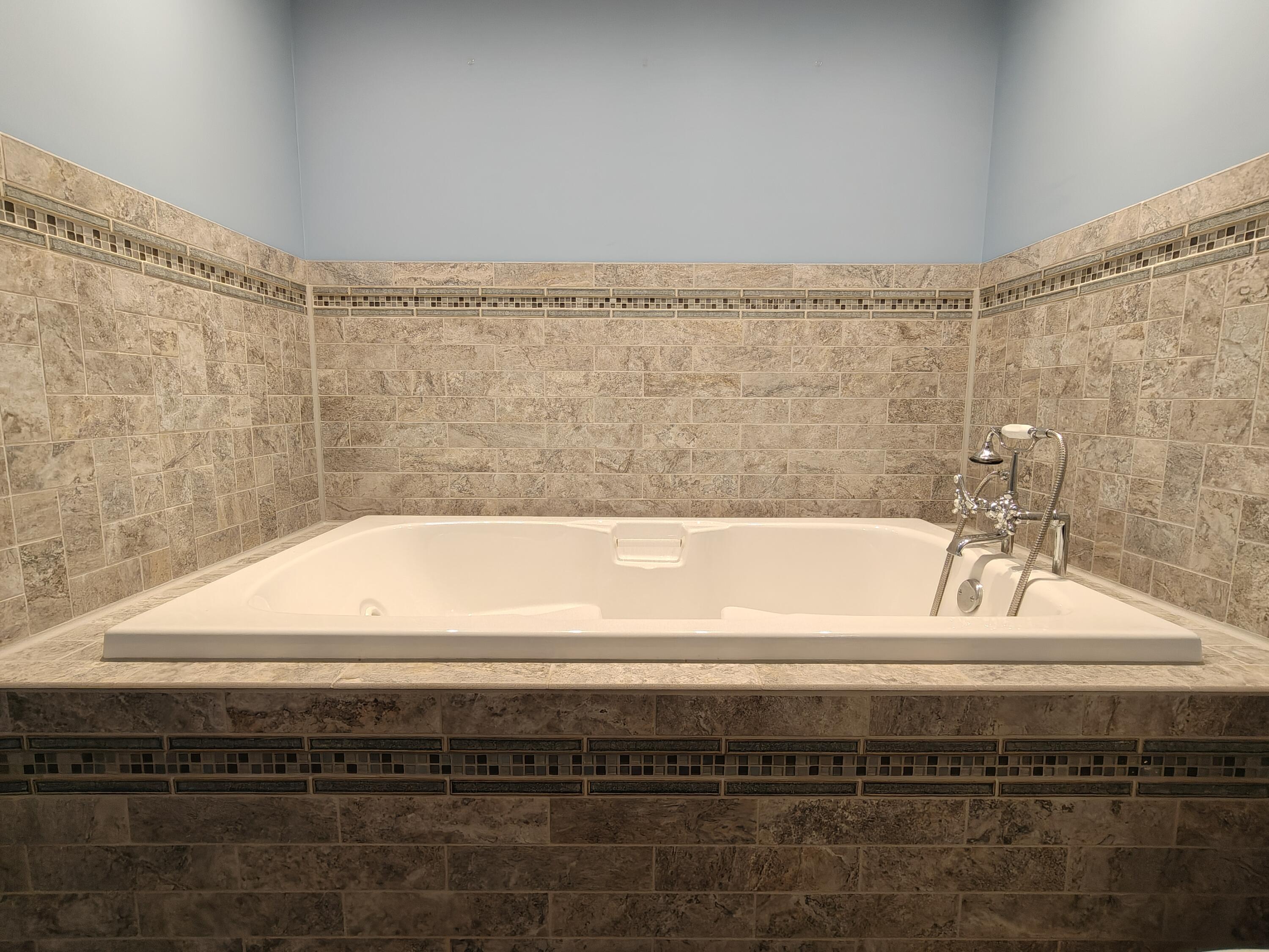 134 Elm Court Hebron, IN 46341 - Photo 21 of 36 a bathroom with a bathtub