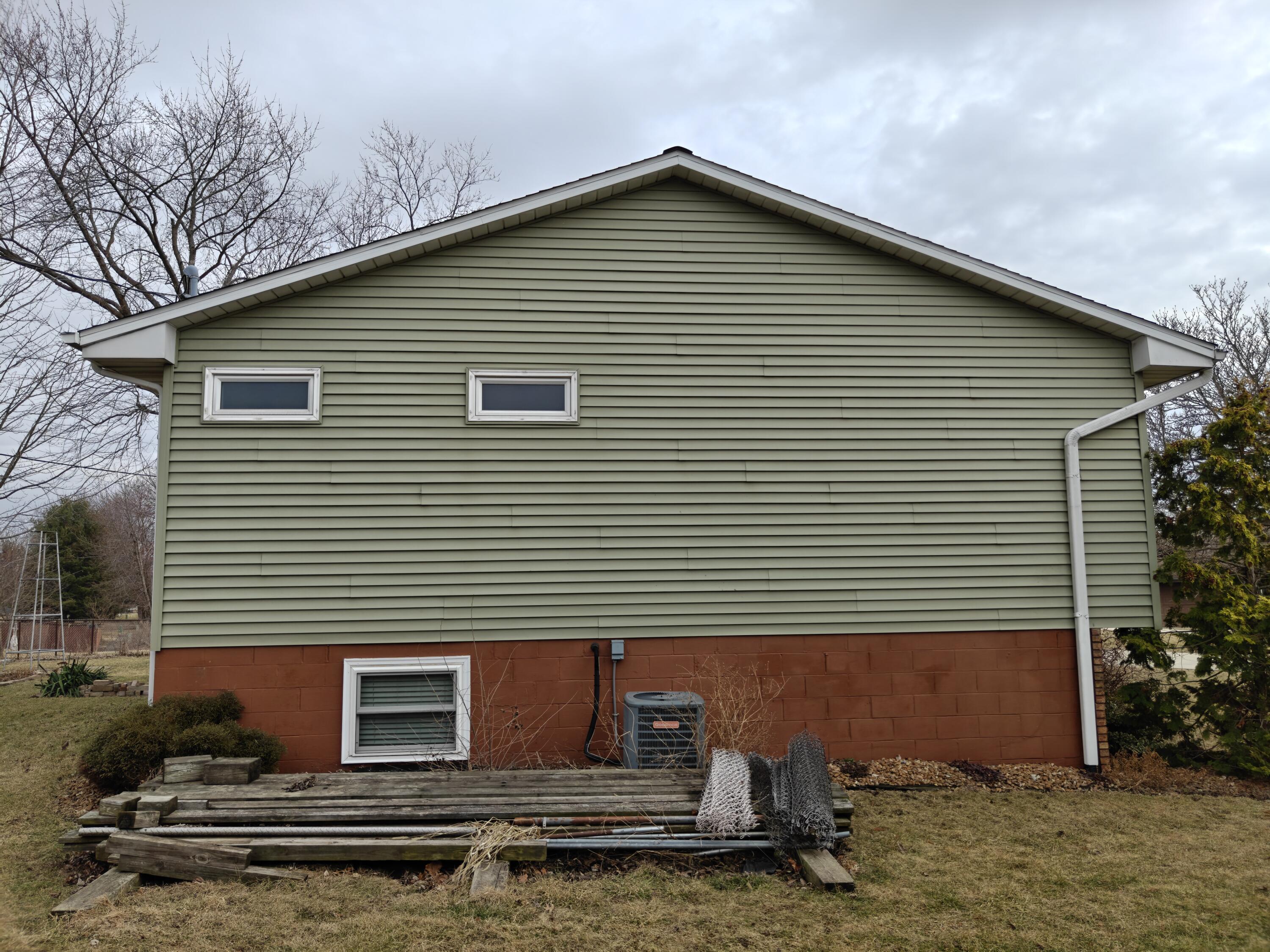 134 Elm Court Hebron, IN 46341 - Photo 35 of 36 a front view of a house with garage