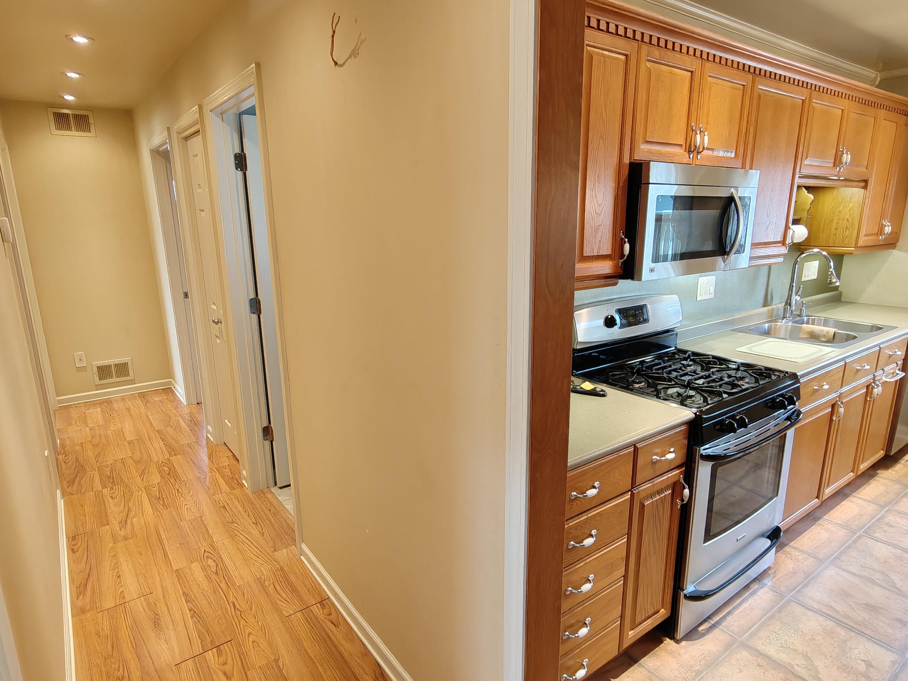 134 Elm Court Hebron, IN 46341 - Photo 10 of 36 a kitchen with stainless steel appliances granite countertop a stove and a refrigerator