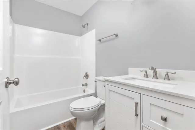 a bathroom with a sink a toilet and a bathtub