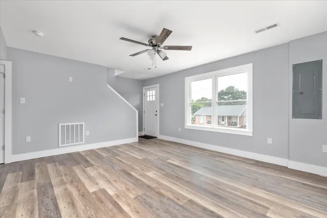 a view of an empty room with a window