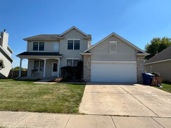 a front view of a house with yard