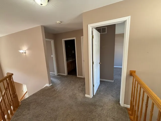 a view of a hallway with closet area