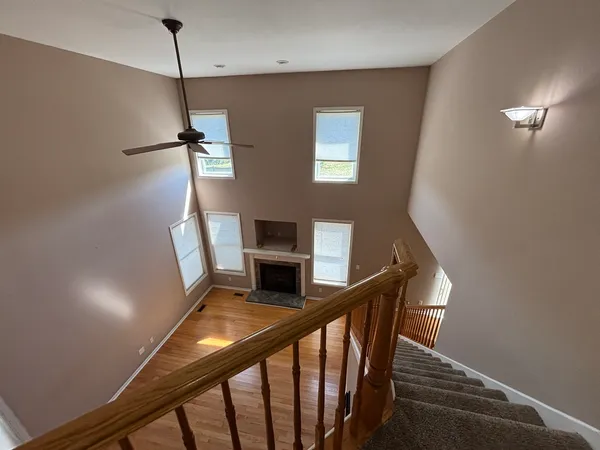 a view of entryway and hall with a front door