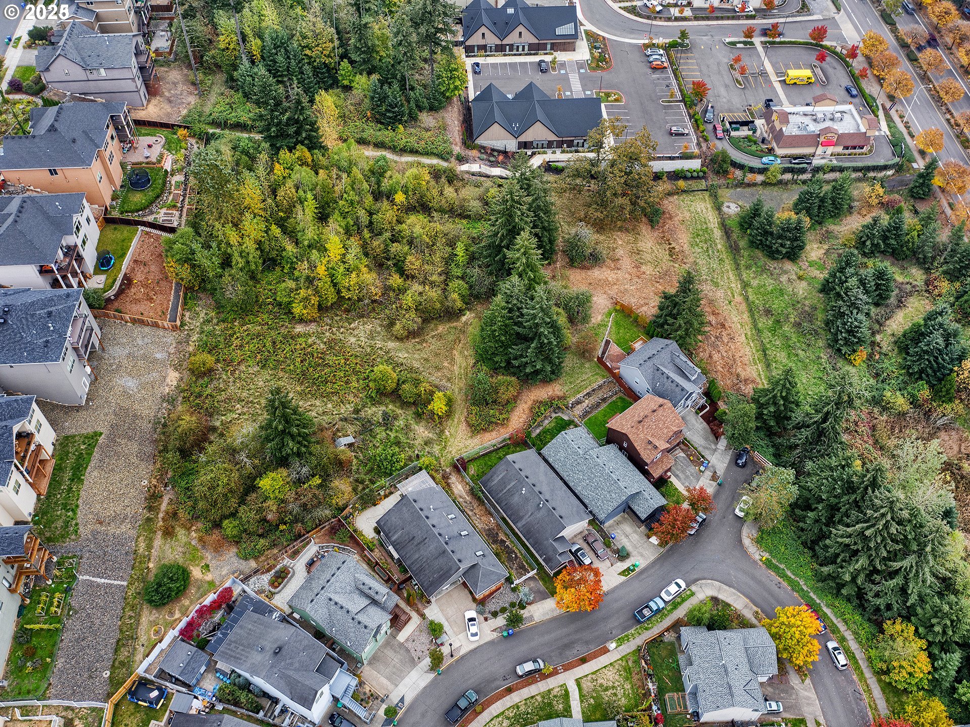 an aerial view of a house with a lake view