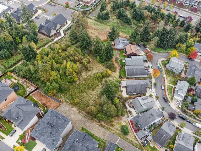 an aerial view of a city with lots of residential buildings