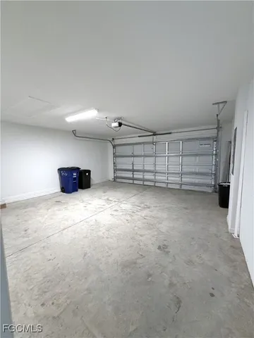 a view of an empty room with a fireplace