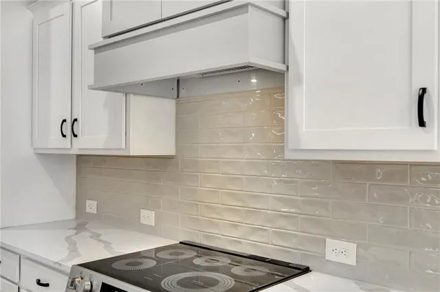 a kitchen with a sink a stove and a refrigerator