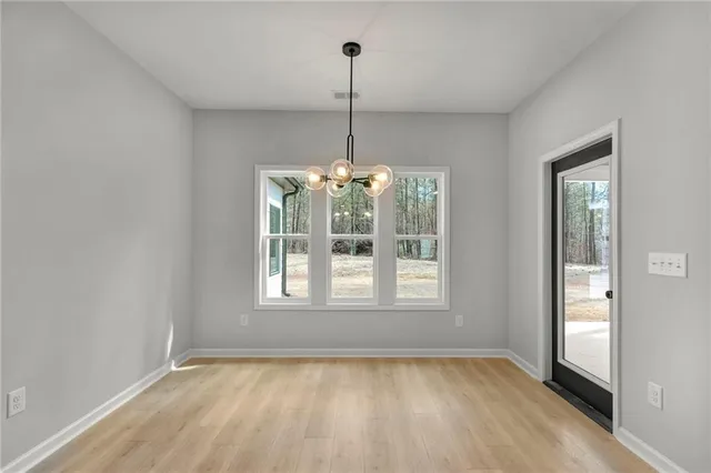 a view of empty room with windows