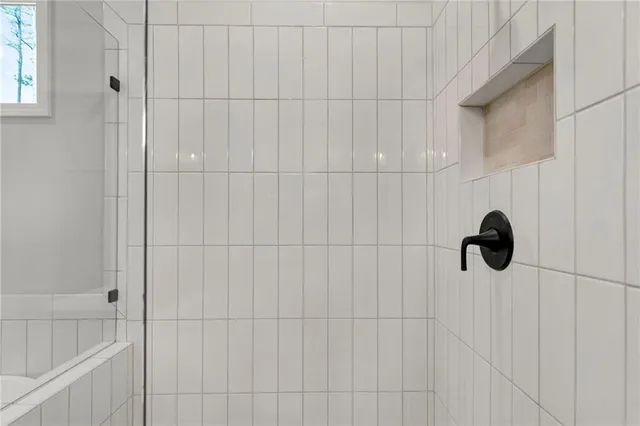 an empty room with a empty space and windows