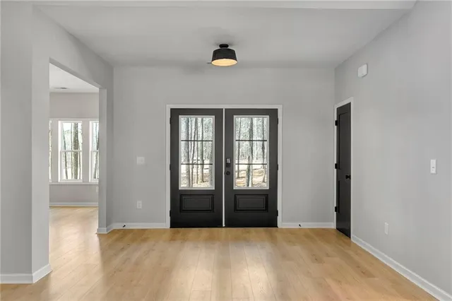 a view of kitchen with cabinets and wooden floor