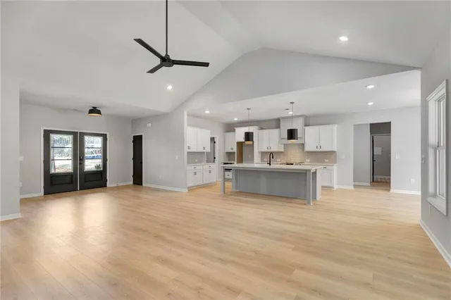 a view of kitchen with sink and wooden floor