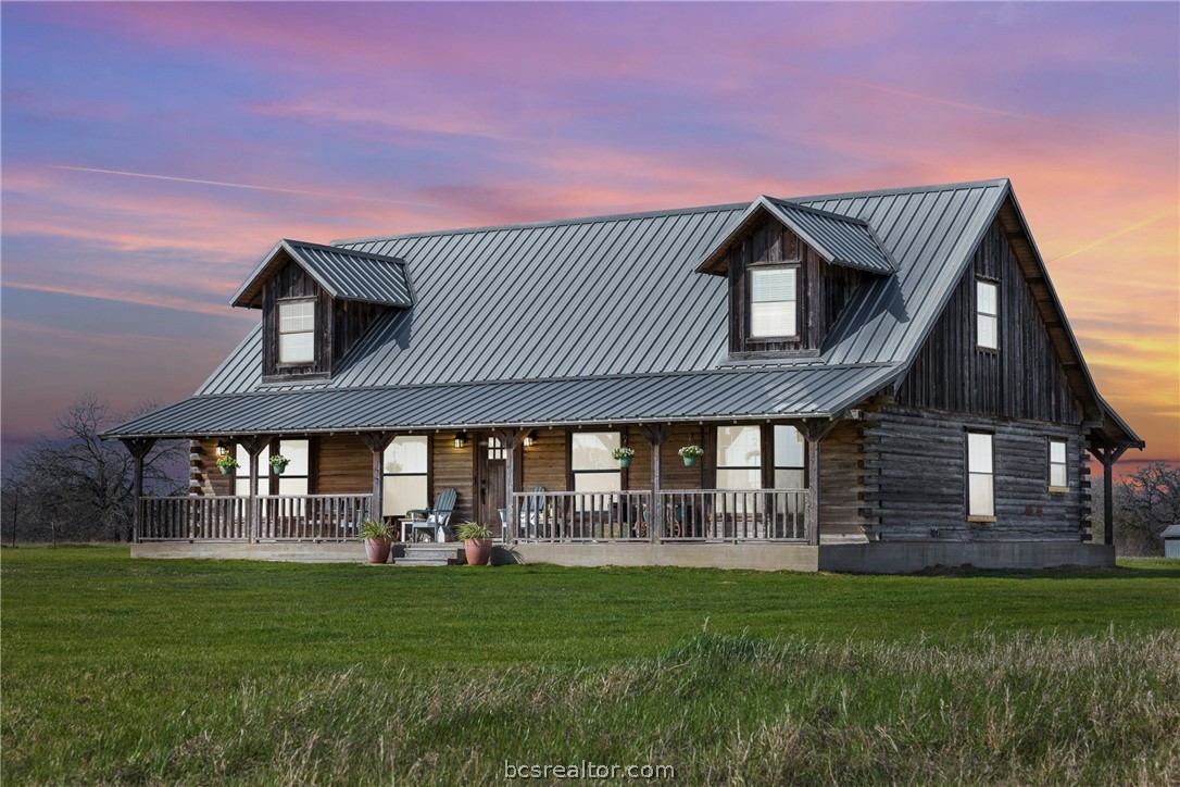 8501 Grassbur Road Bryan, TX 77808 - Photo 1 of 36 a front view of a house with a garden