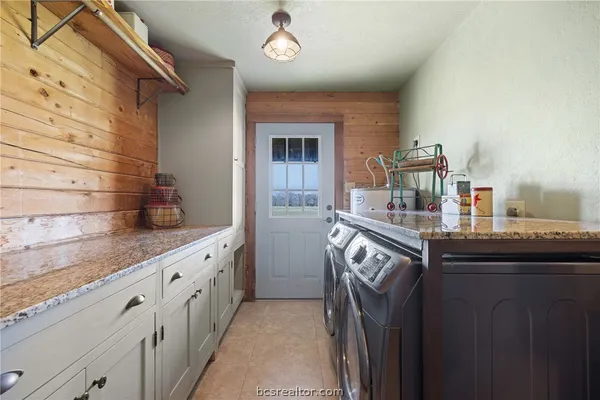 a kitchen with a refrigerator and cabinets
