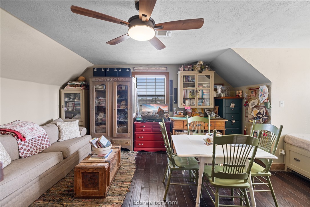 8501 Grassbur Road Bryan, TX 77808 - Photo 27 of 36 a view of a dining room with furniture window and wooden floor