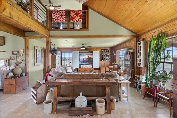 a gym room with lots of wooden furniture