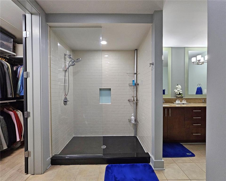 4561 Olde Perimeter Way, Unit 1002 Atlanta, GA 30346 - Photo 13 of 43 a view of walk in closet