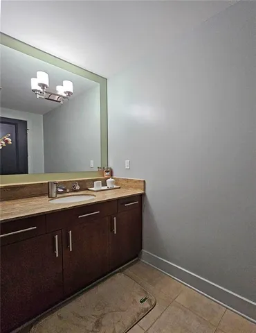 a bathroom with a sink and a mirror