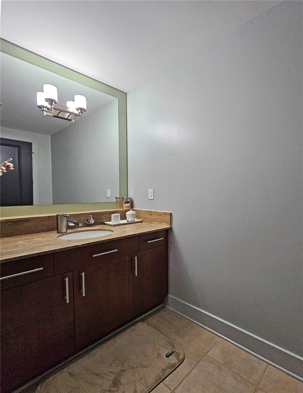 4561 Olde Perimeter Way, Unit 1002 Atlanta, GA 30346 - Photo 19 of 43 a bathroom with a sink and a mirror
