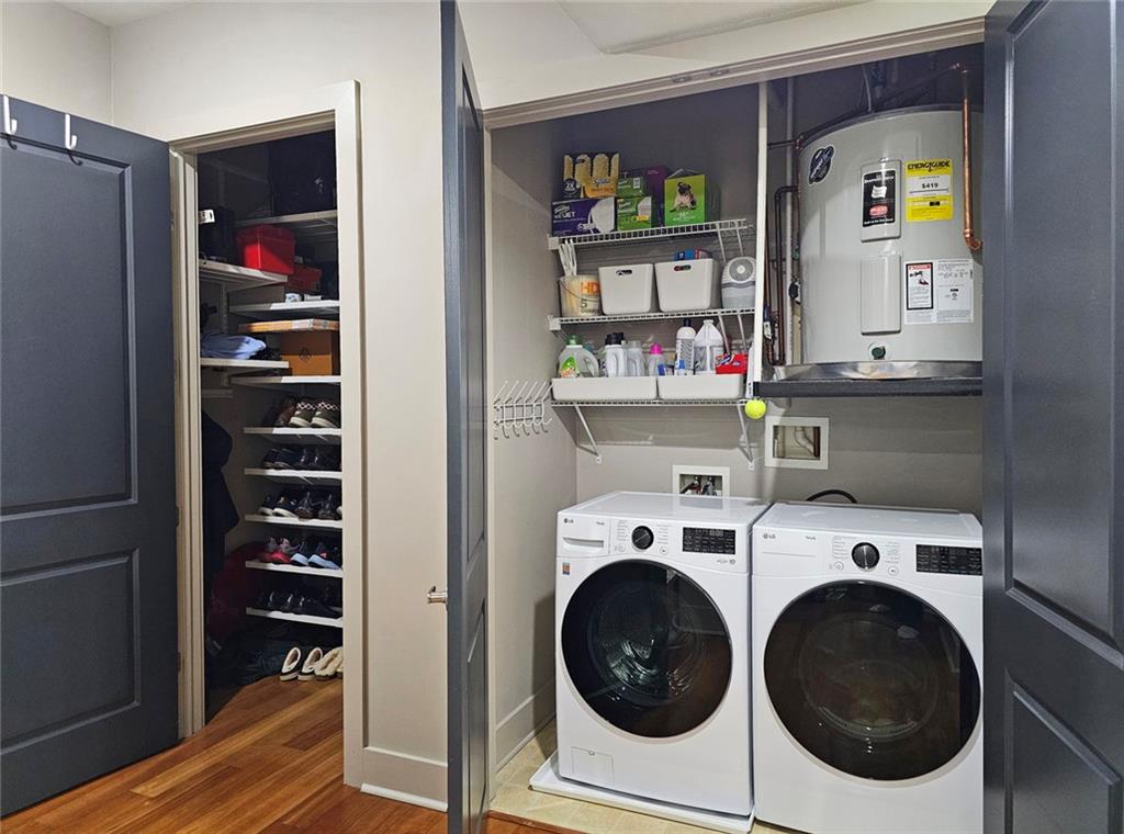 4561 Olde Perimeter Way, Unit 1002 Atlanta, GA 30346 - Photo 20 of 43 a utility room with dryer and washer