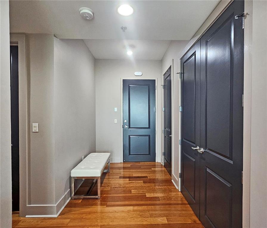 4561 Olde Perimeter Way, Unit 1002 Atlanta, GA 30346 - Photo 4 of 43 a bathroom with a sink and a mirror