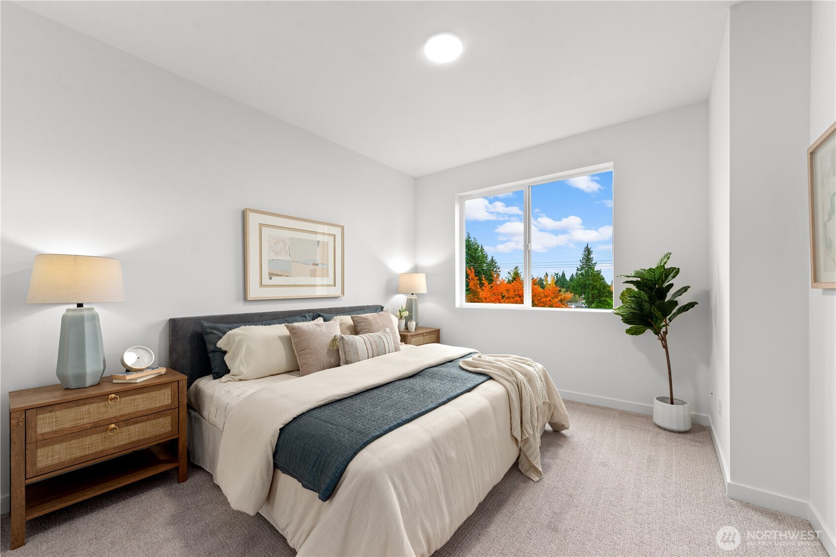 1421 Southwest 111th Lane Seattle, WA 98146 - Photo 25 of 35 a bedroom with a bed and a potted plant