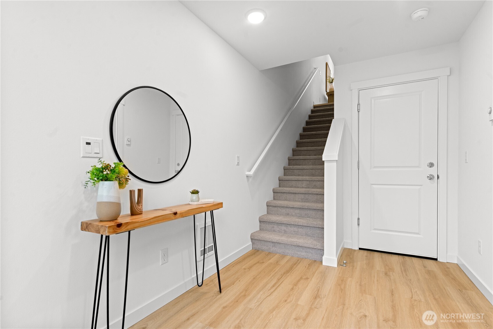 1421 Southwest 111th Lane Seattle, WA 98146 - Photo 4 of 35 a view of a hallway with wooden floor and workspace