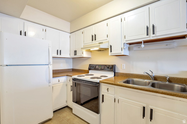 290 North 500 West, Unit 211 Bountiful, UT 84010 - Photo 8 of 21 Kitchen Featuring White Cabinetry, a White Top-Freezer Refrigerator, a White Electric Range, and a Stainless Steel Double Basin Sink