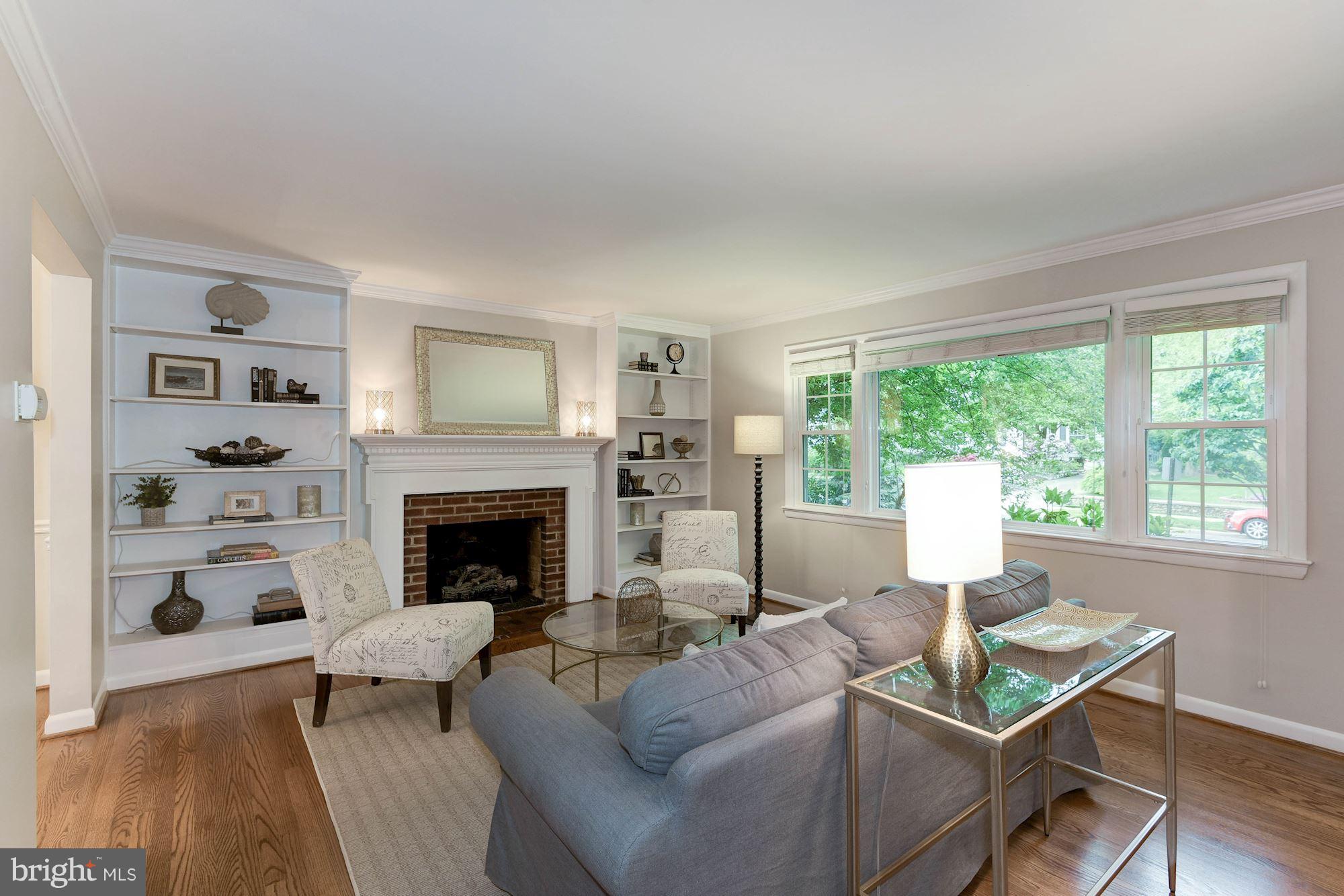 407 Russell Road Alexandria, VA 22301 - Photo 3 of 30 Living room features gas fireplace and built-ins