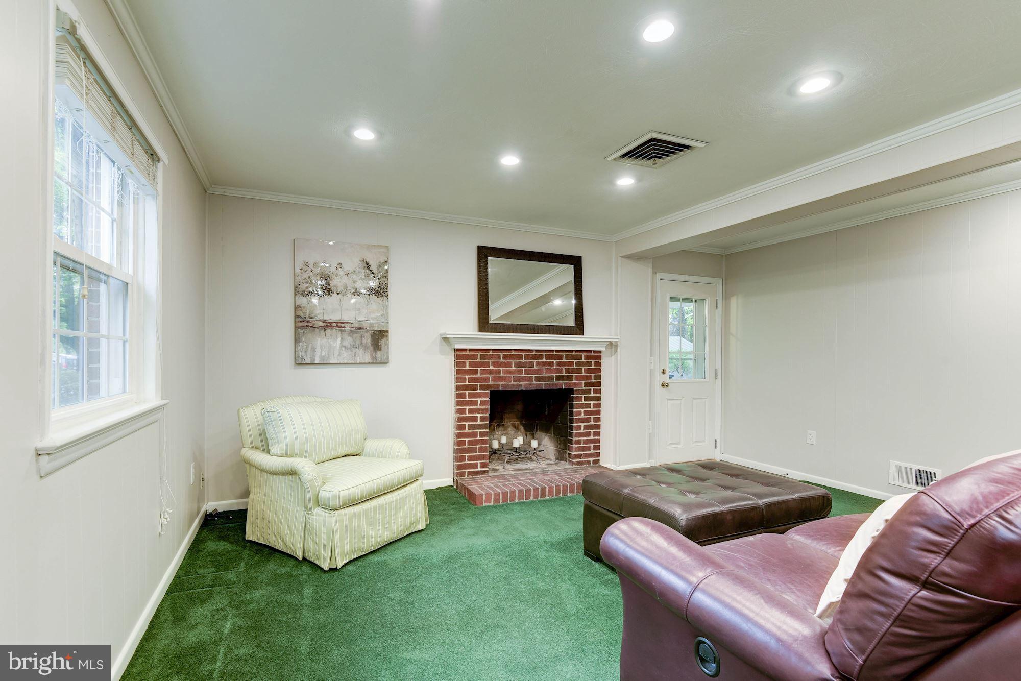 407 Russell Road Alexandria, VA 22301 - Photo 21 of 30 Wood-burning fireplace in recreation room