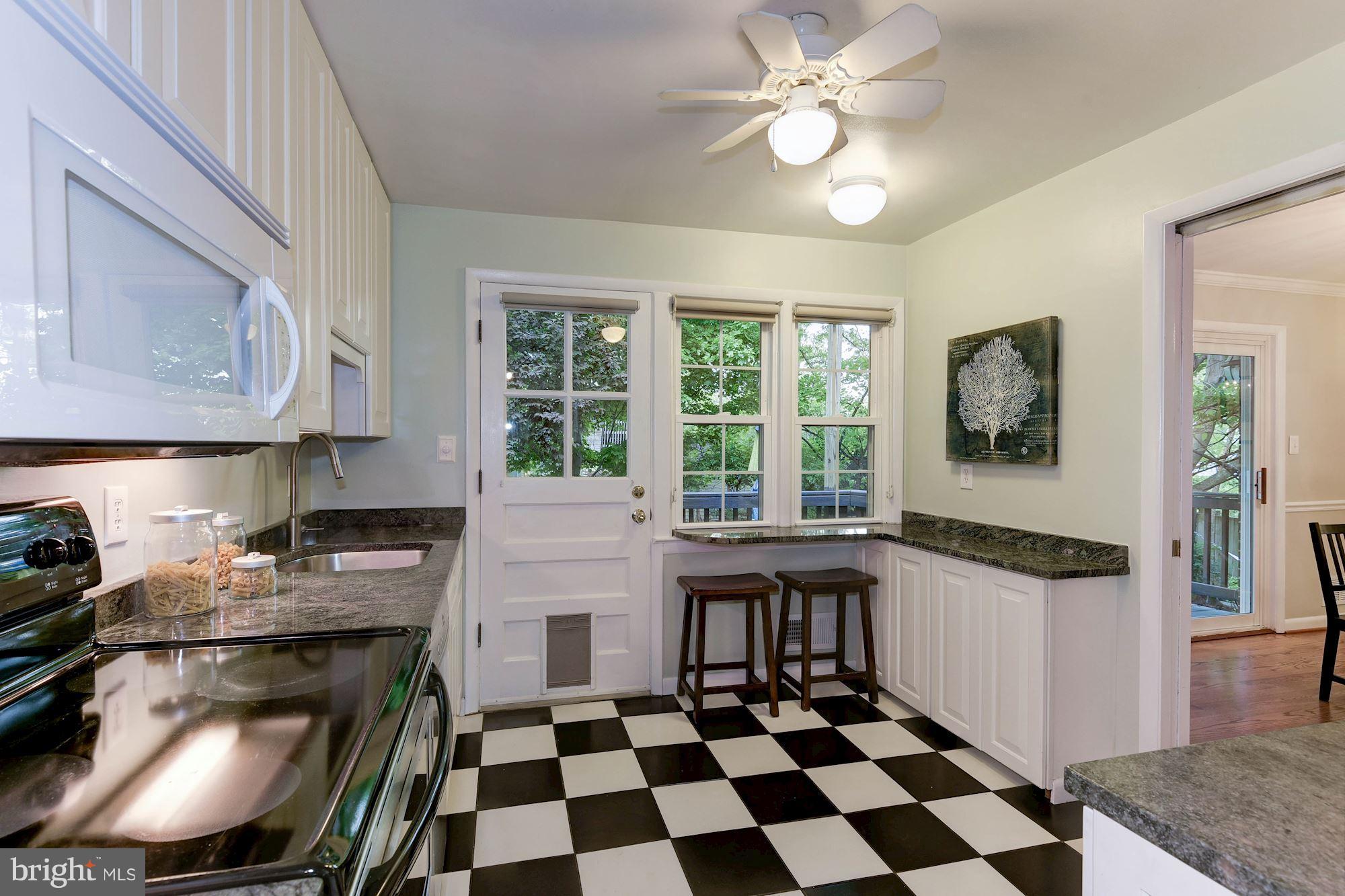 407 Russell Road Alexandria, VA 22301 - Photo 8 of 30 Outdoor access and breakfast bar in kitchen
