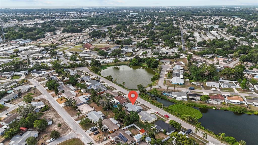 1623 Plum Tree Road Holiday, FL 34690 - Photo 26 of 33 an aerial view of residential houses with outdoor space and lake view