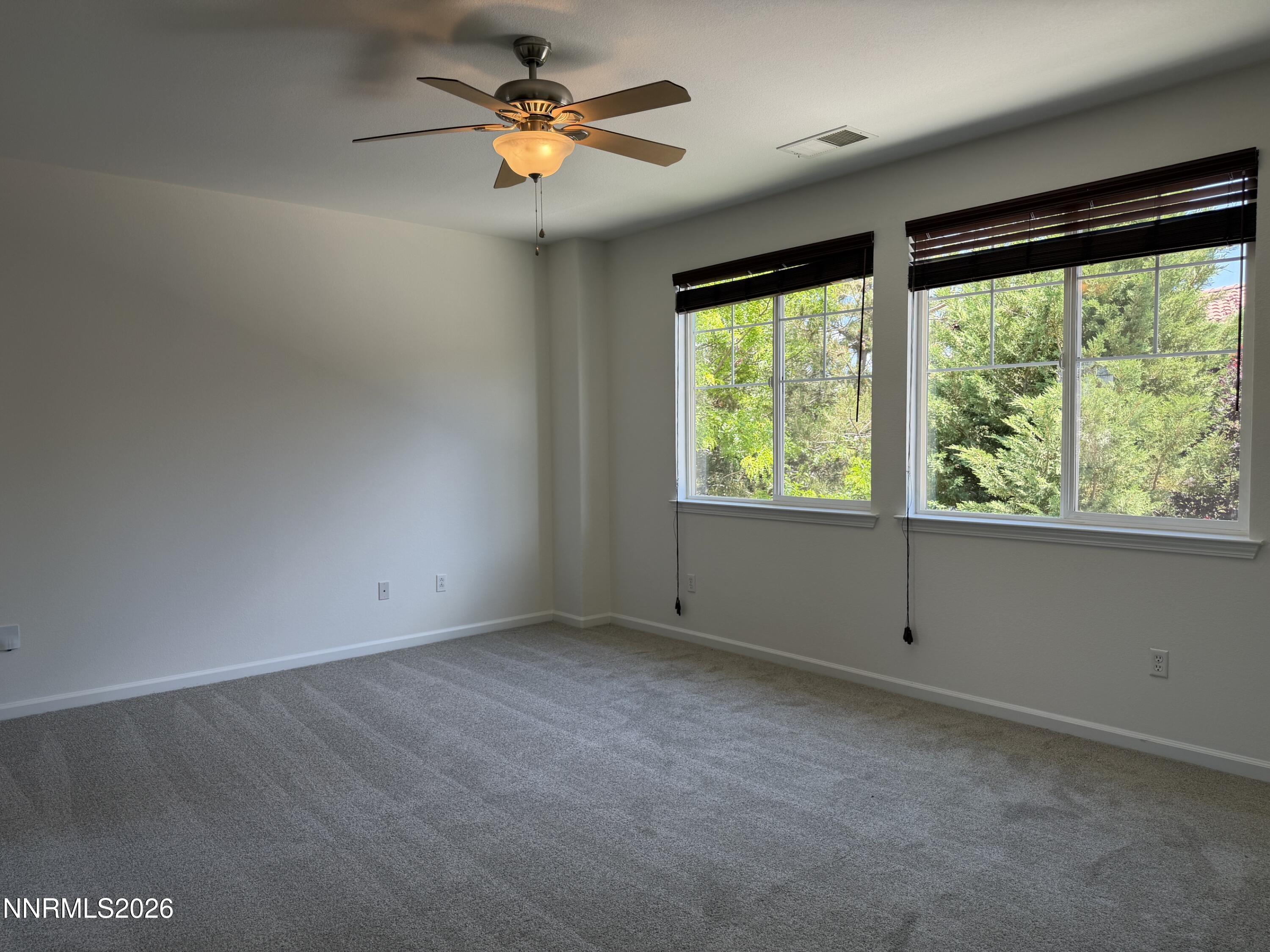 10890 Oakhaven Drive Reno, NV 89521 - Photo 13 of 28 a view of an empty room with a window