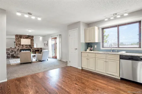 a view of a room with furniture window and wooden floor