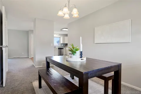 a view of a closet area with wooden floor