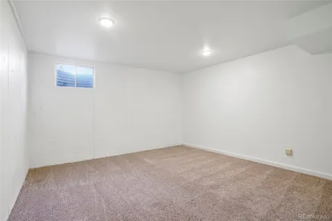 a view of ocean with a building in the background