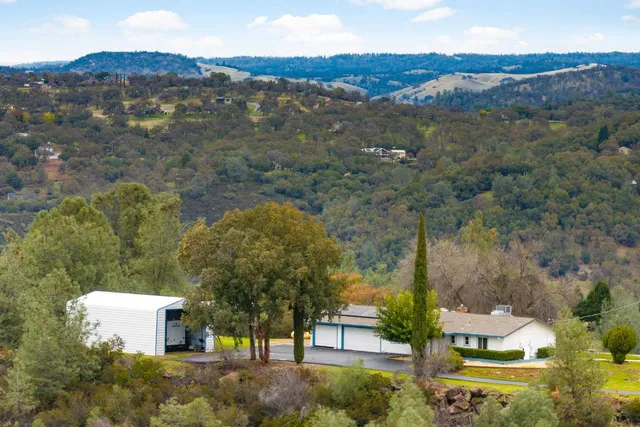 an aerial view of residential house with outdoor space