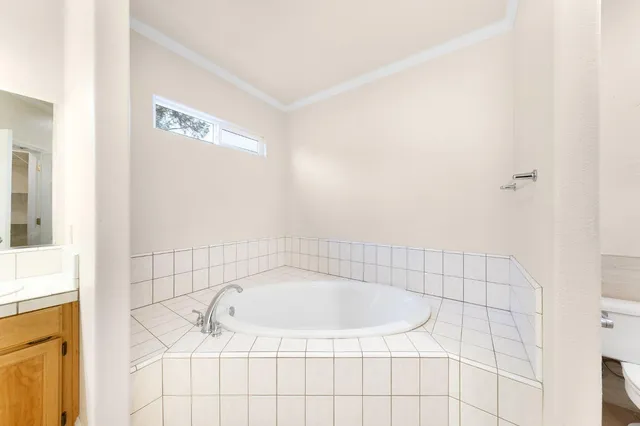 a bathroom with a sink and vanity