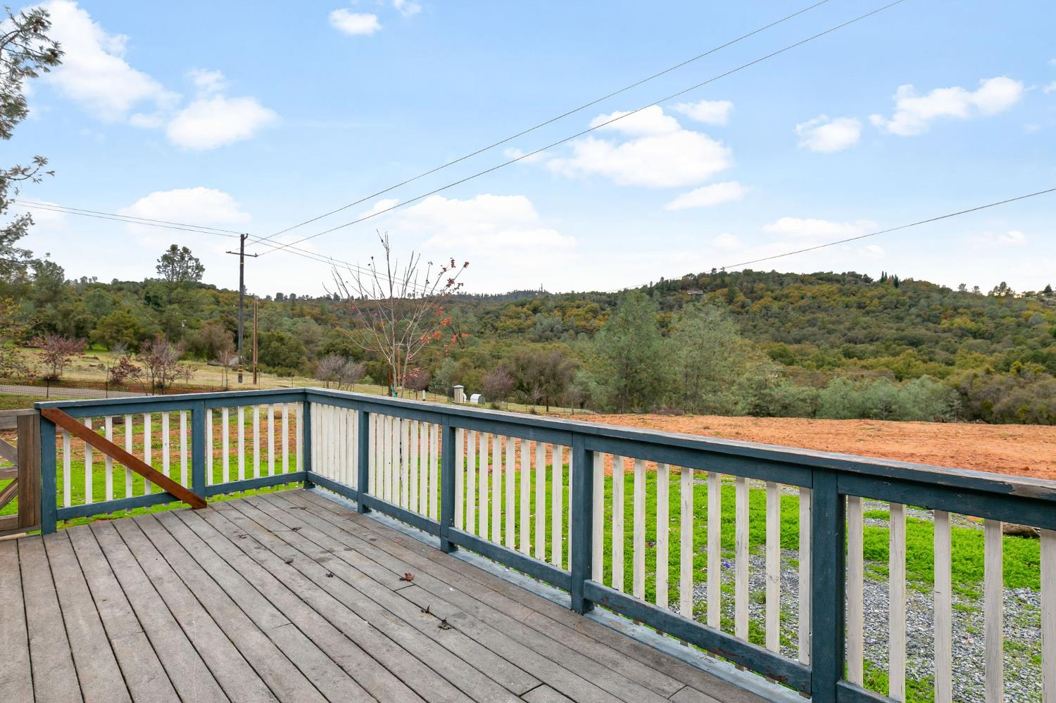 1261 Jurgens Road Rescue, CA 95672 - Photo 33 of 74 a balcony with wooden floor and fence