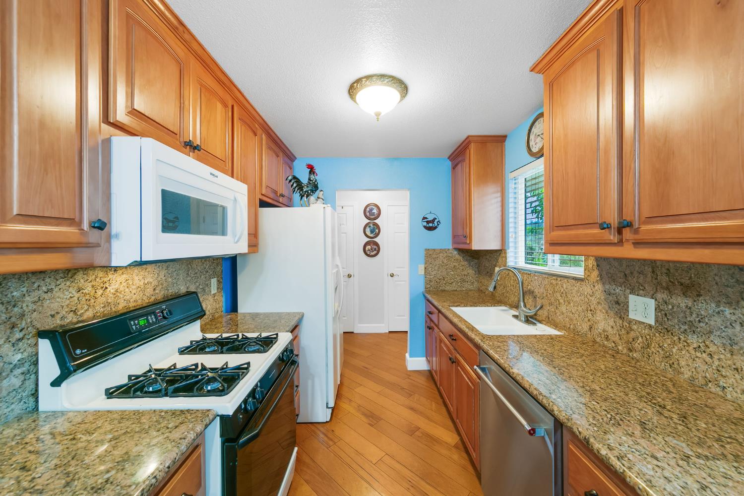 1261 Jurgens Road Rescue, CA 95672 - Photo 40 of 74 a kitchen with stainless steel appliances granite countertop a sink stove and refrigerator