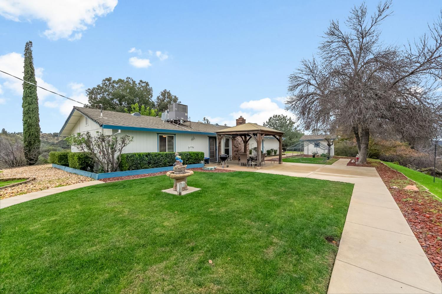 1261 Jurgens Road Rescue, CA 95672 - Photo 60 of 74 a front view of a house with yard and green space