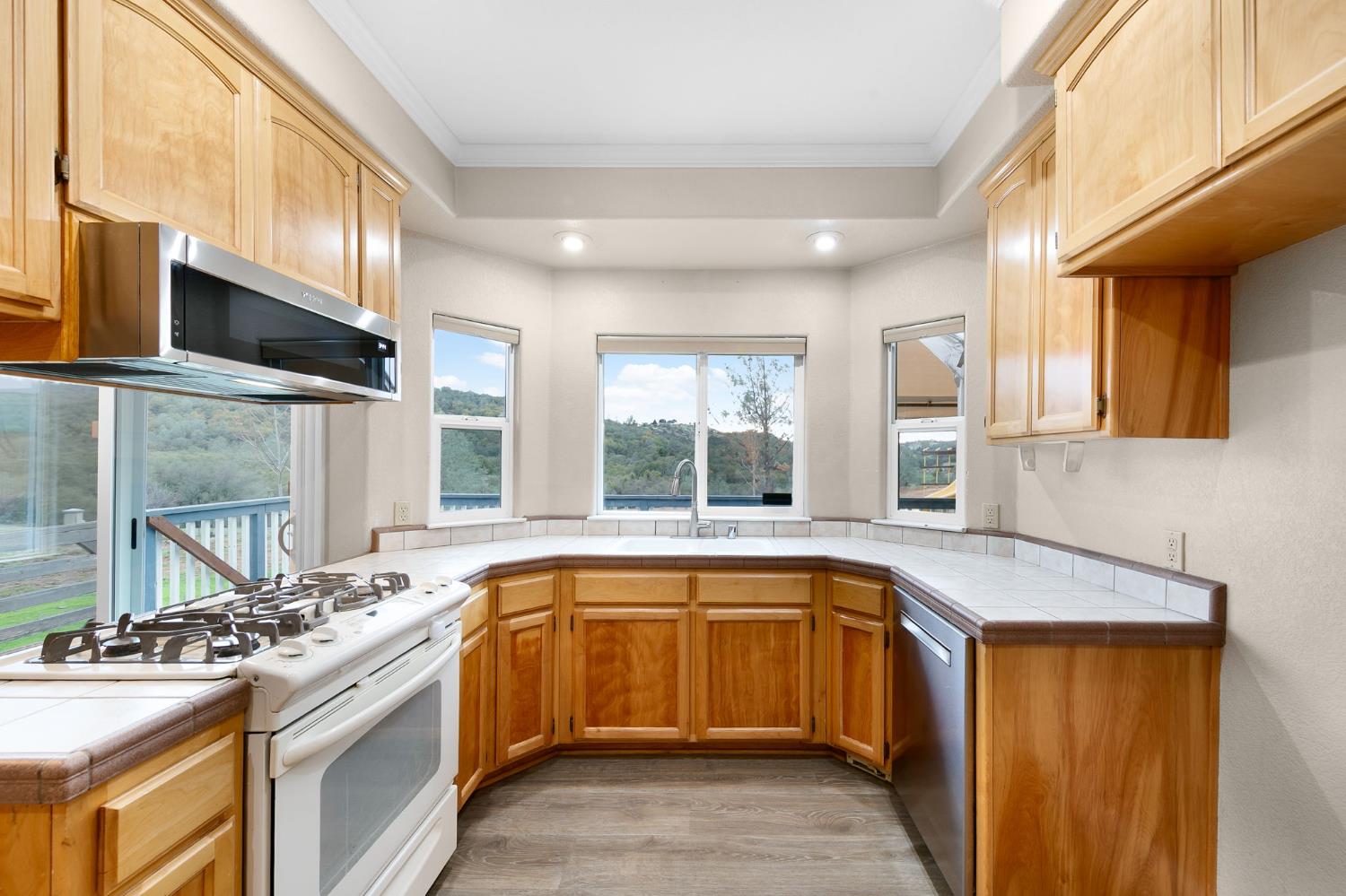1261 Jurgens Road Rescue, CA 95672 - Photo 9 of 74 a kitchen with a sink stove and cabinets
