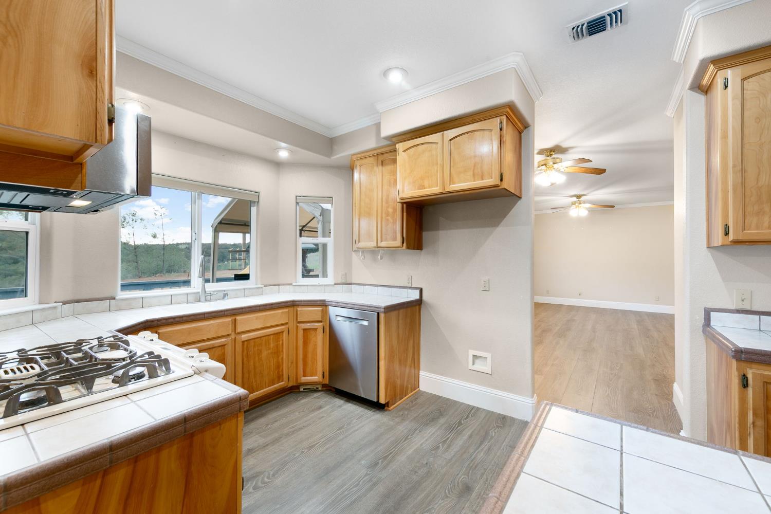 1261 Jurgens Road Rescue, CA 95672 - Photo 10 of 74 a kitchen with stainless steel appliances granite countertop a sink stove and refrigerator