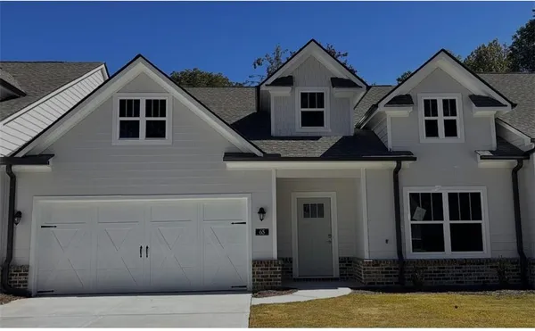 front view of a house with a yard