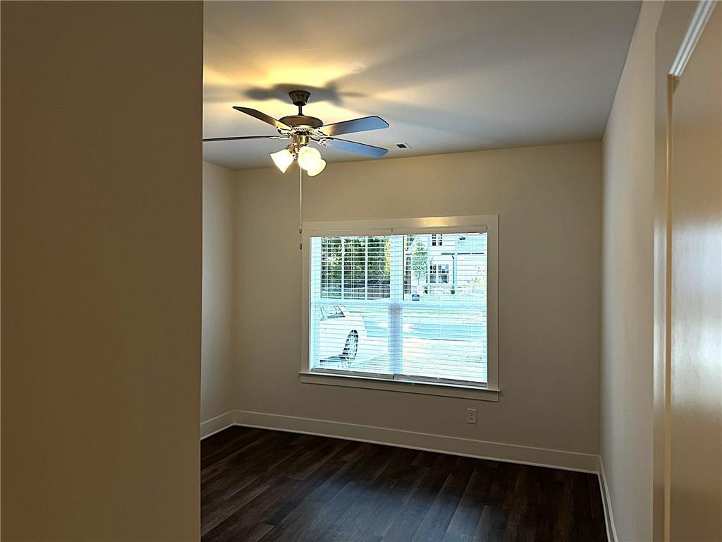 65 Village Court Cleveland, GA 30528 - Photo 14 of 21 a view of a livingroom with a ceiling fan and window
