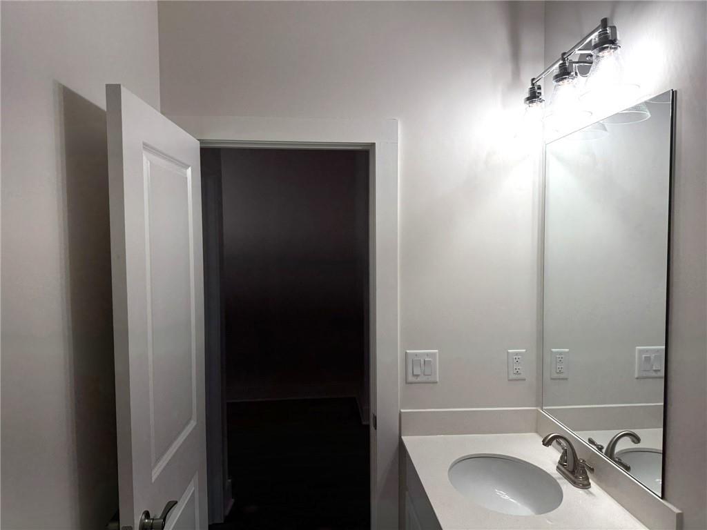 65 Village Court Cleveland, GA 30528 - Photo 16 of 21 a bathroom with a sink and a mirror