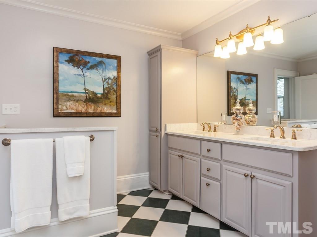 2025 St Marys Street Raleigh, NC 27608 - Photo 17 of 25 a spacious bathroom with a double vanity sink and a mirror