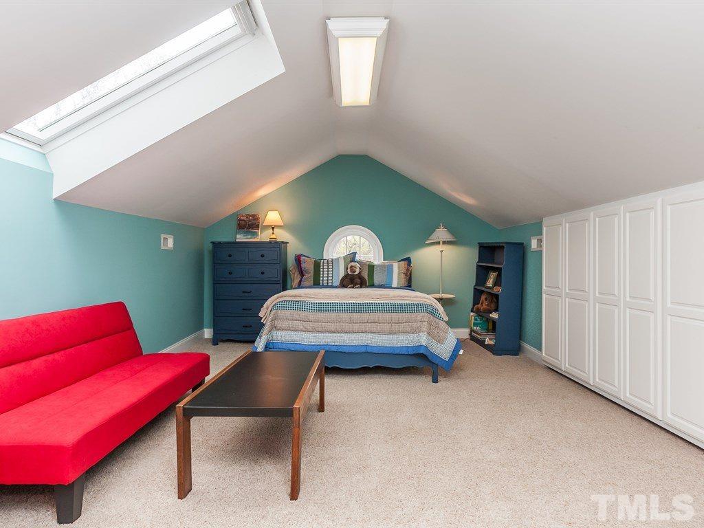2025 St Marys Street Raleigh, NC 27608 - Photo 22 of 25 a bedroom with furniture and a bed