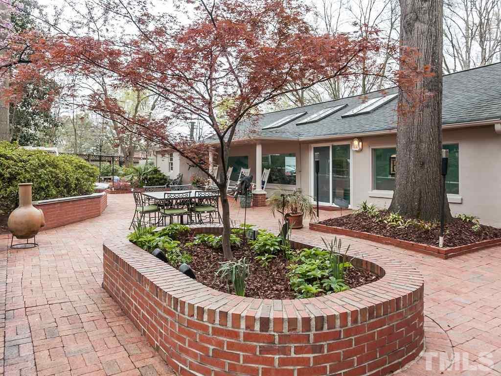 2025 St Marys Street Raleigh, NC 27608 - Photo 23 of 25 a view of a house with backyard and sitting area