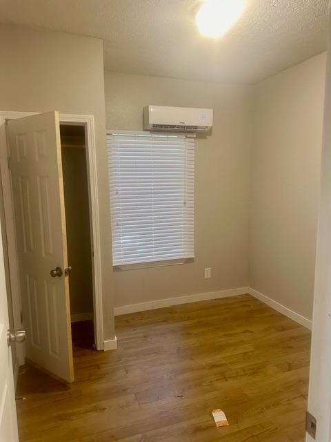2300 8th Street Port Arthur, TX 77640 - Photo 2 of 7 an empty room with wooden floor and closet
